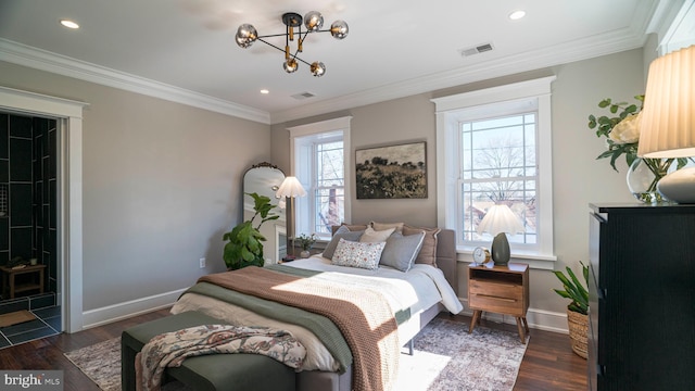 bedroom with visible vents, baseboards, wood finished floors, and ornamental molding