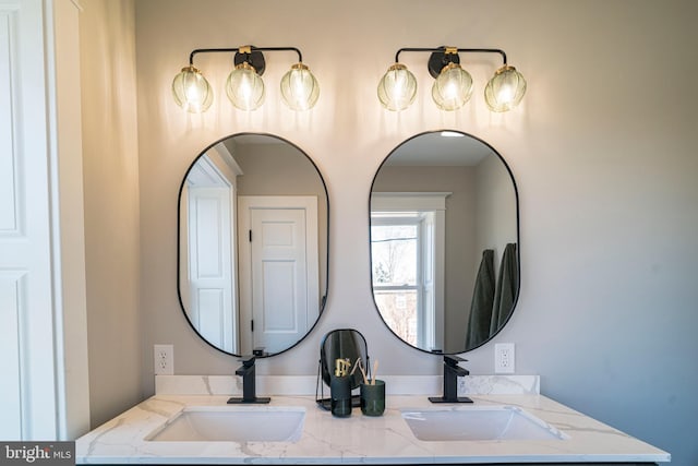 bathroom featuring a sink and double vanity