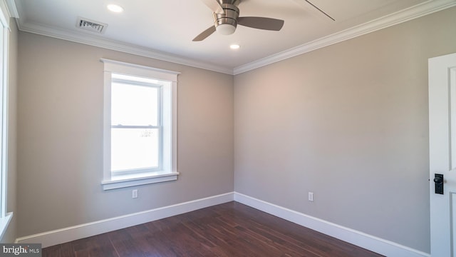 empty room featuring ceiling fan, dark wood-style flooring, visible vents, baseboards, and ornamental molding