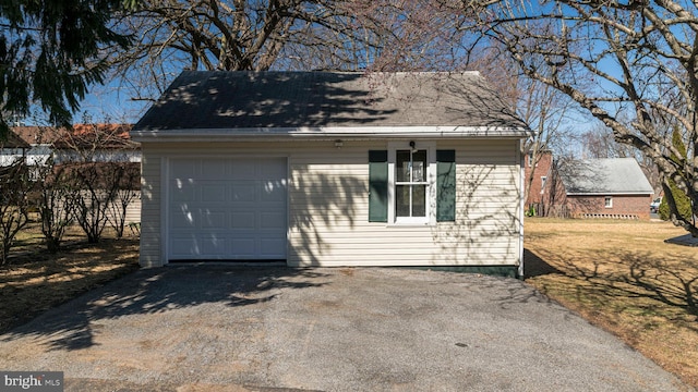 garage with aphalt driveway