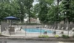 view of pool with fence