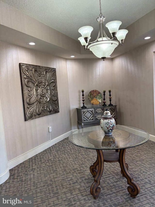 dining space featuring baseboards, a chandelier, carpet floors, recessed lighting, and a textured ceiling