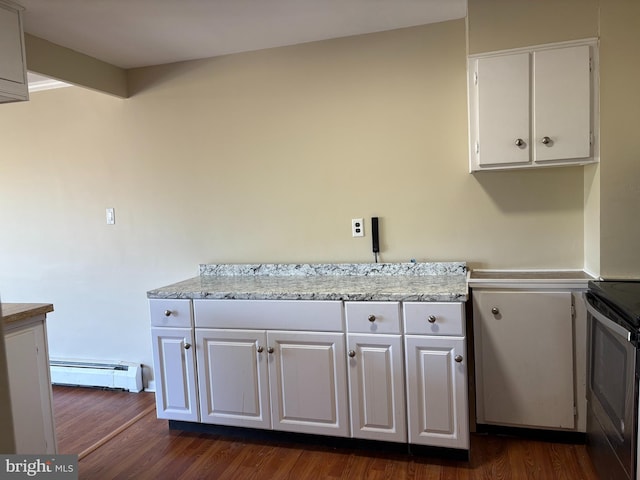 kitchen with a baseboard heating unit, stainless steel electric stove, dark wood finished floors, and white cabinetry