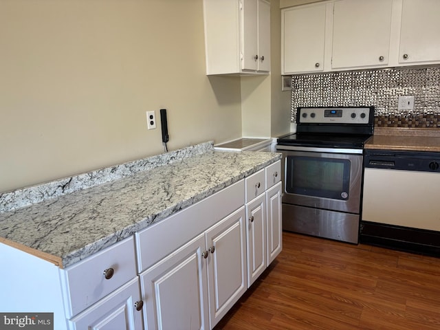 kitchen with dark wood-type flooring, decorative backsplash, stainless steel range with electric stovetop, white dishwasher, and white cabinetry