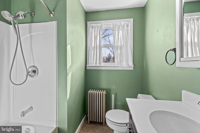 bathroom with vanity, radiator, baseboards, tile patterned flooring, and toilet