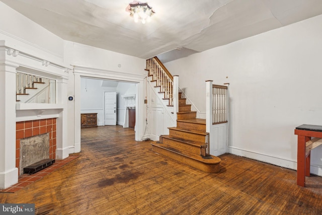 interior space with a fireplace and wood finished floors