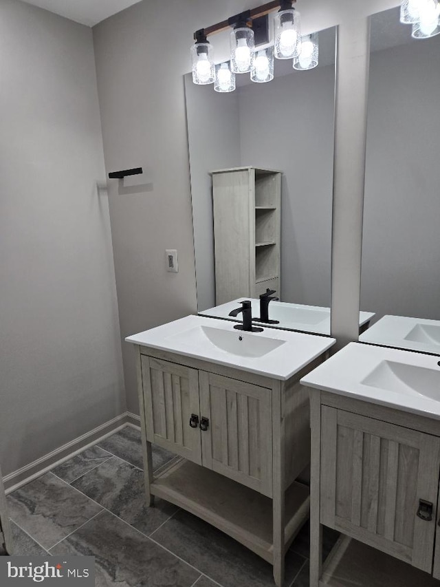 bathroom with baseboards and vanity