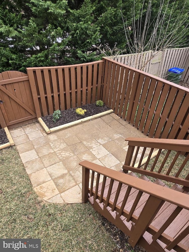 view of patio featuring fence