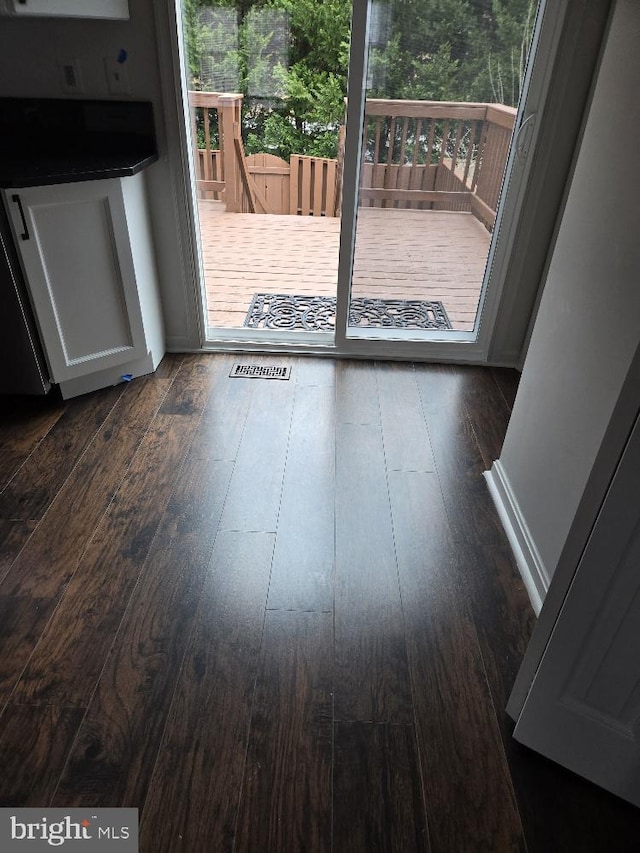 entryway featuring visible vents, wood-type flooring, and a wealth of natural light