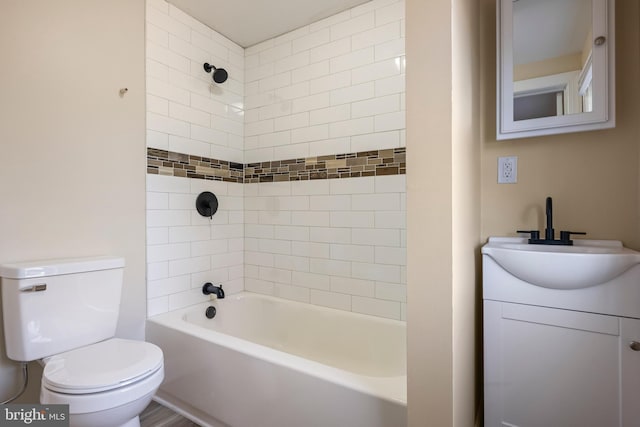 bathroom with vanity, toilet, and shower / bathtub combination