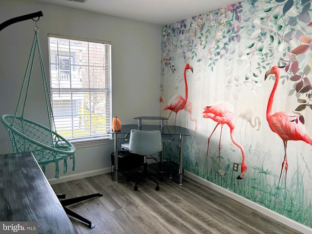 home office with wood finished floors and baseboards