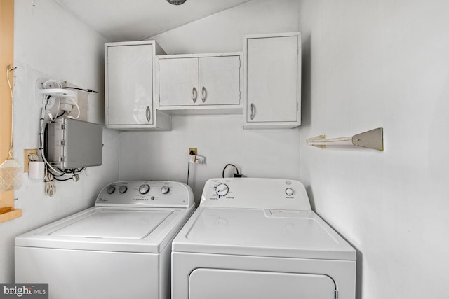 laundry area featuring independent washer and dryer and cabinet space