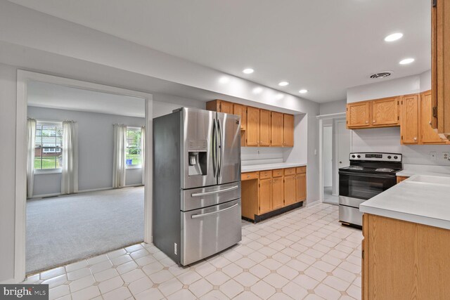 kitchen with visible vents, light floors, recessed lighting, light countertops, and appliances with stainless steel finishes