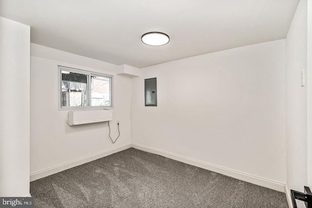 empty room with dark colored carpet, an AC wall unit, electric panel, and baseboards