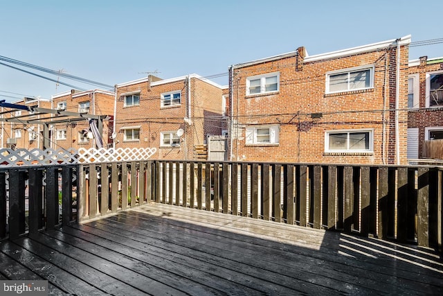 wooden terrace featuring a residential view