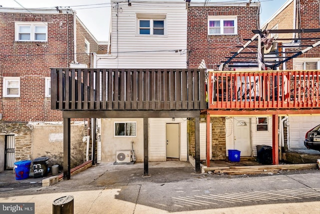 rear view of property with ac unit