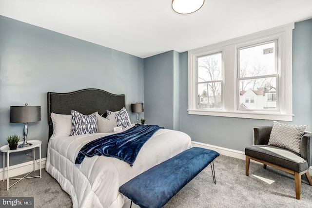 carpeted bedroom with baseboards