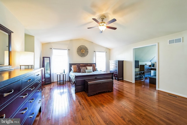 bedroom featuring visible vents, baseboards, lofted ceiling, and dark wood-style flooring