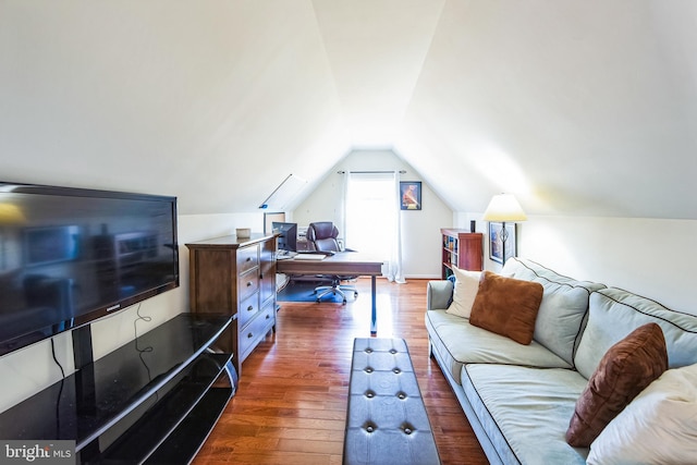 living area featuring lofted ceiling and dark wood-style flooring