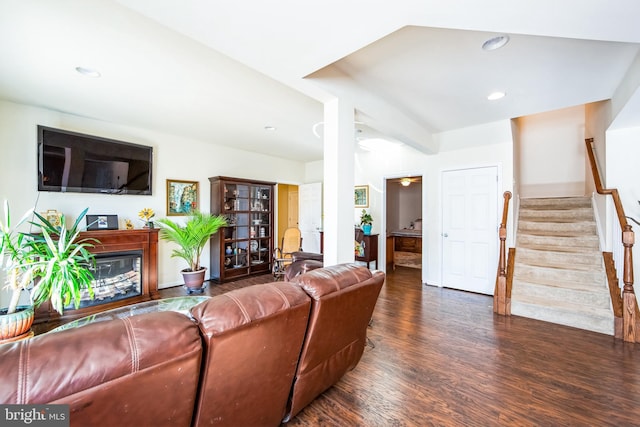 living area featuring recessed lighting, stairs, and wood finished floors