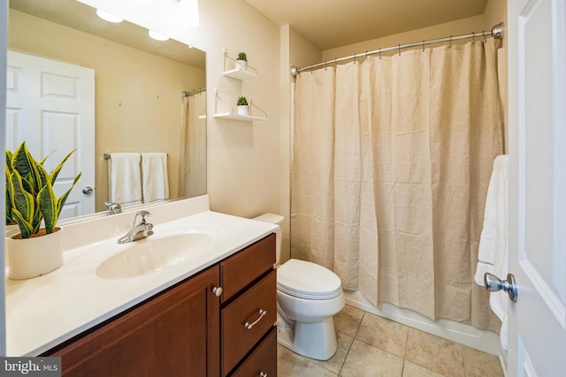 full bathroom with tile patterned flooring, toilet, and vanity