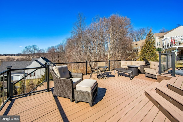 wooden terrace featuring outdoor lounge area