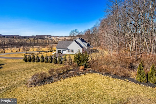 view of property exterior with a lawn