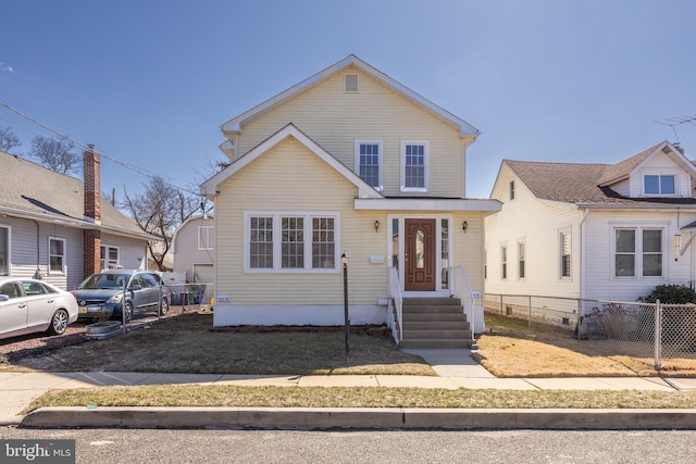 view of front of property featuring fence