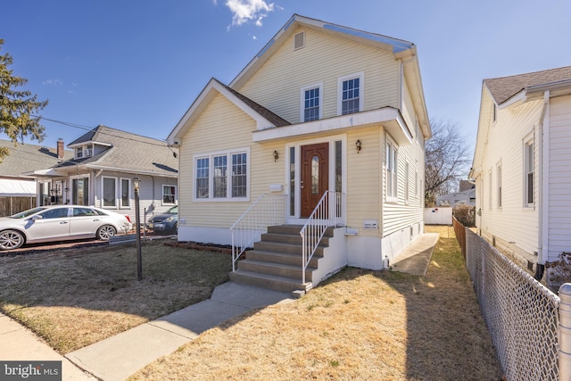 view of front of house featuring fence