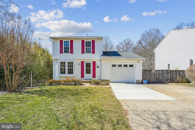 traditional home featuring driveway, a front yard, a garage, and fence