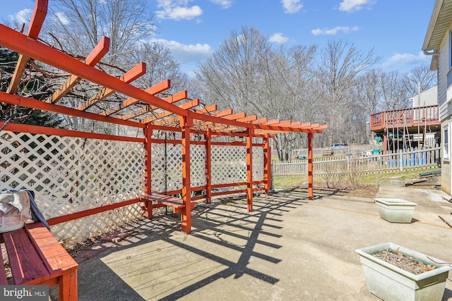 view of patio / terrace featuring a pergola and fence