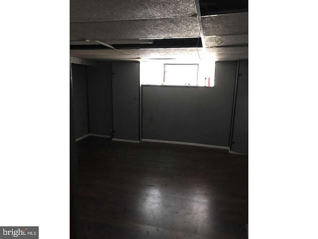 unfurnished room with a paneled ceiling