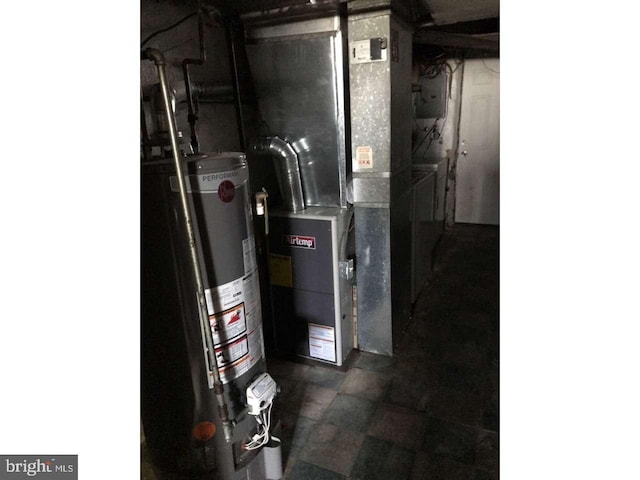 utility room with gas water heater and heating unit