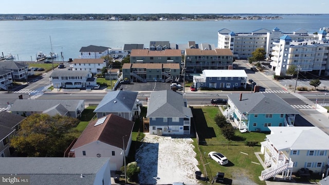 bird's eye view featuring a water view and a residential view