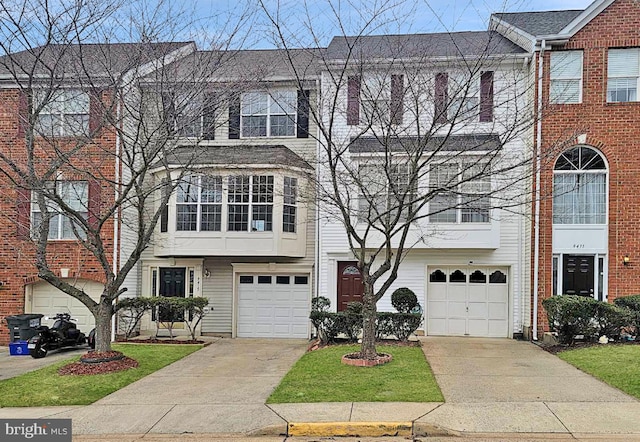 view of property with driveway and an attached garage