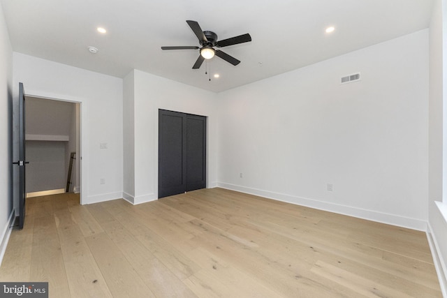 unfurnished bedroom with visible vents, a ceiling fan, recessed lighting, light wood-style floors, and baseboards