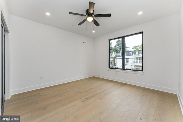 empty room with visible vents, recessed lighting, light wood finished floors, baseboards, and ceiling fan