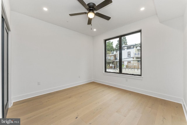 unfurnished room with recessed lighting, baseboards, light wood-style flooring, and ceiling fan