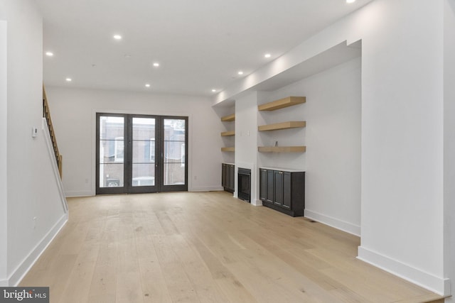 unfurnished living room featuring recessed lighting and light wood-type flooring