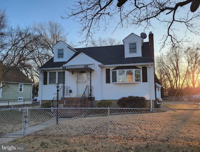 view of front of house featuring a fenced front yard, roof with shingles, and a chimney