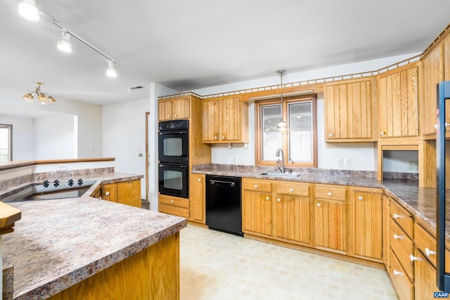 kitchen featuring light floors, visible vents, a sink, and black appliances