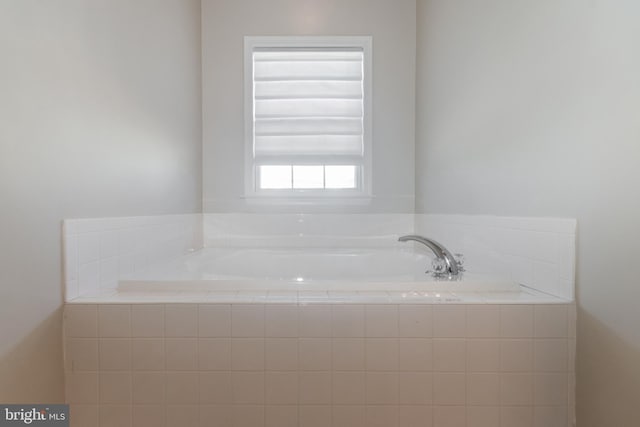 bathroom with a garden tub