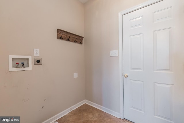 laundry room with baseboards, washer hookup, light tile patterned floors, laundry area, and hookup for an electric dryer