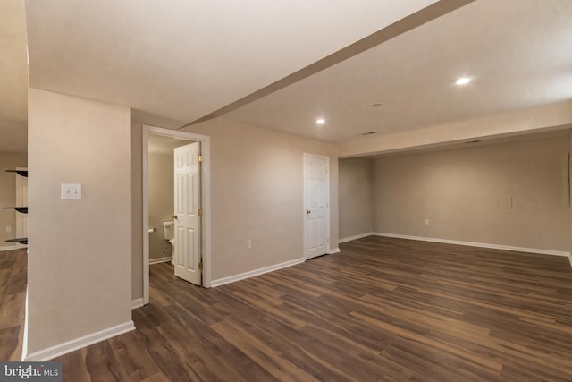 interior space with dark wood finished floors, recessed lighting, and baseboards