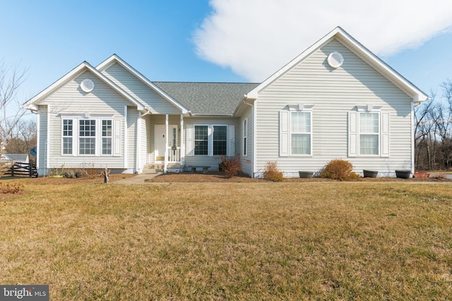 ranch-style home with crawl space, roof with shingles, and a front yard