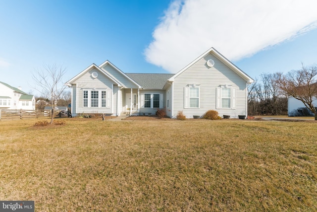 single story home featuring a front lawn and fence