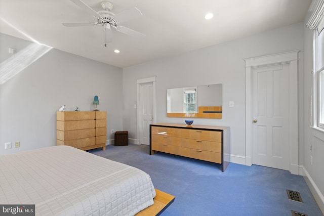 bedroom featuring visible vents, baseboards, and carpet