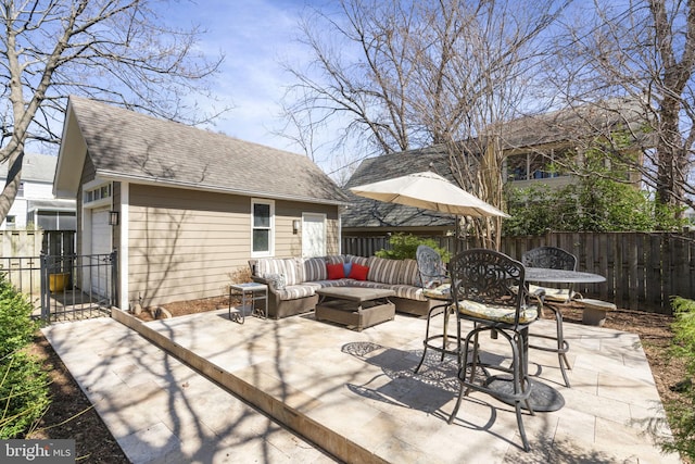 view of patio with an outdoor hangout area, an outdoor structure, and fence
