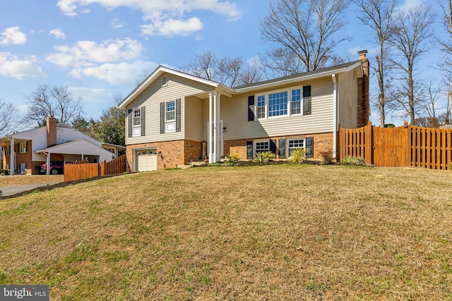 split foyer home featuring a garage, fence, brick siding, and a chimney