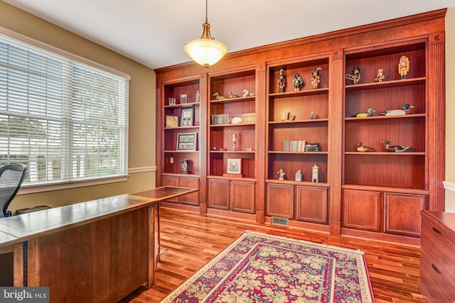 office space with visible vents and light wood finished floors